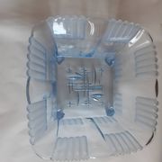 Polished transparent blue glass fruit bowl