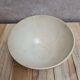 Old ironstone bowl with vintage blue and ochre decoration.