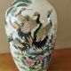 Vintage ceramic vase with Asian decor.