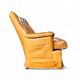 Fauteuil club en cuir de mouton des années 1970 avec porte-revues