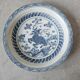 Pair of antique Chinese decorative plates with dragon motif.
