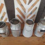 Set of 4 old metal milk canister jars