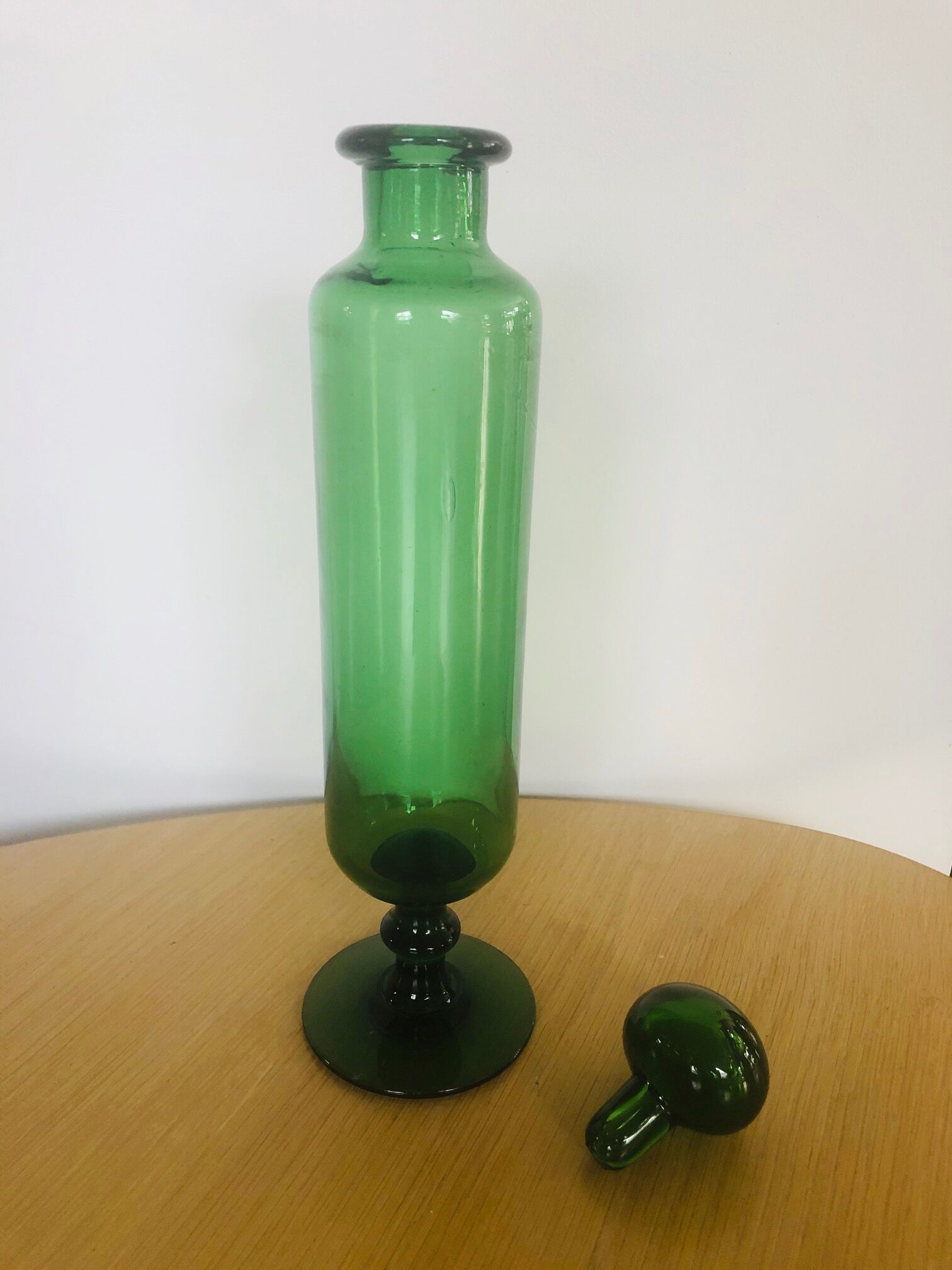 Green glass standing apothecary bottle