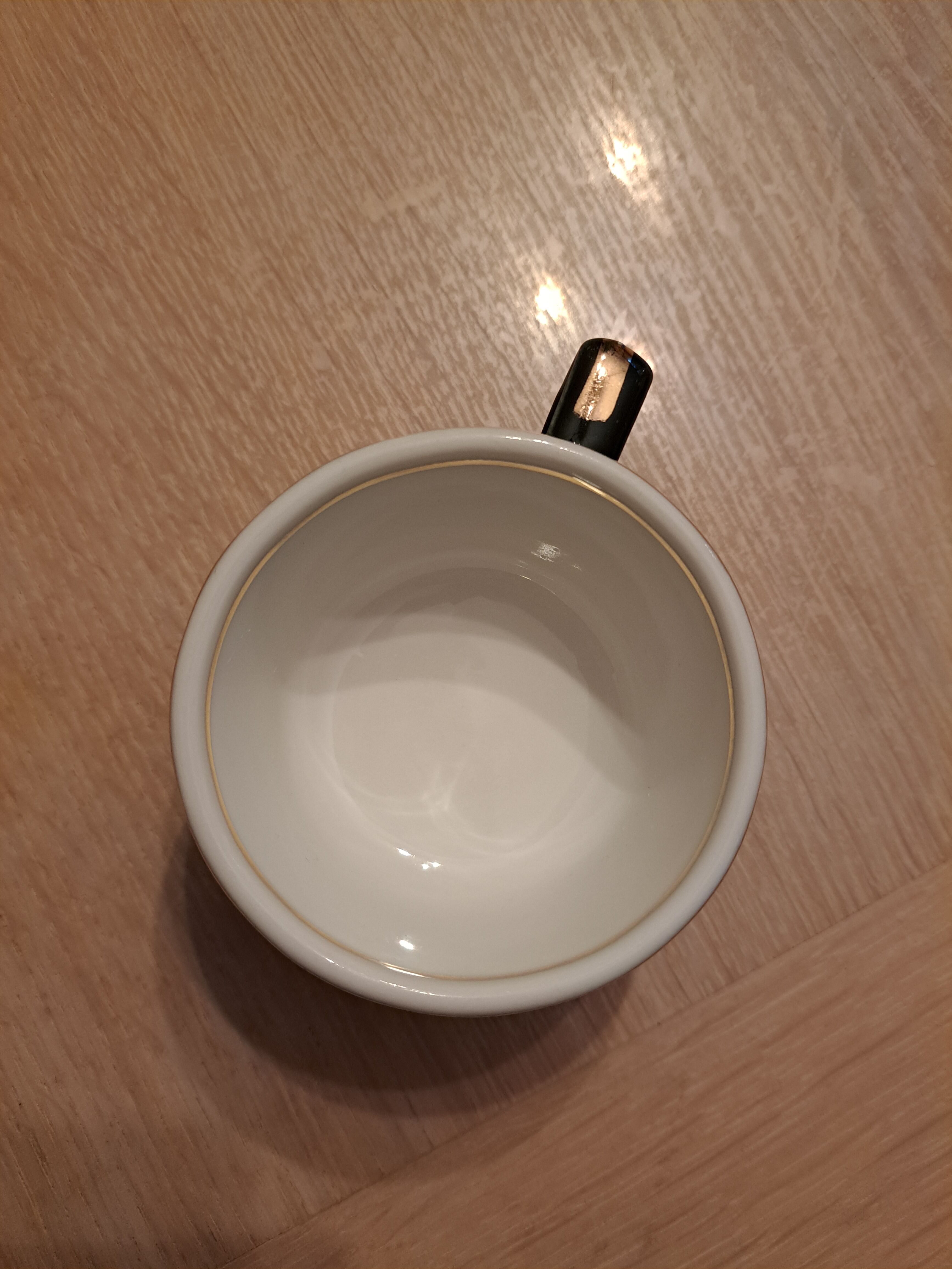 Green and gold coffee cups and sub-cups