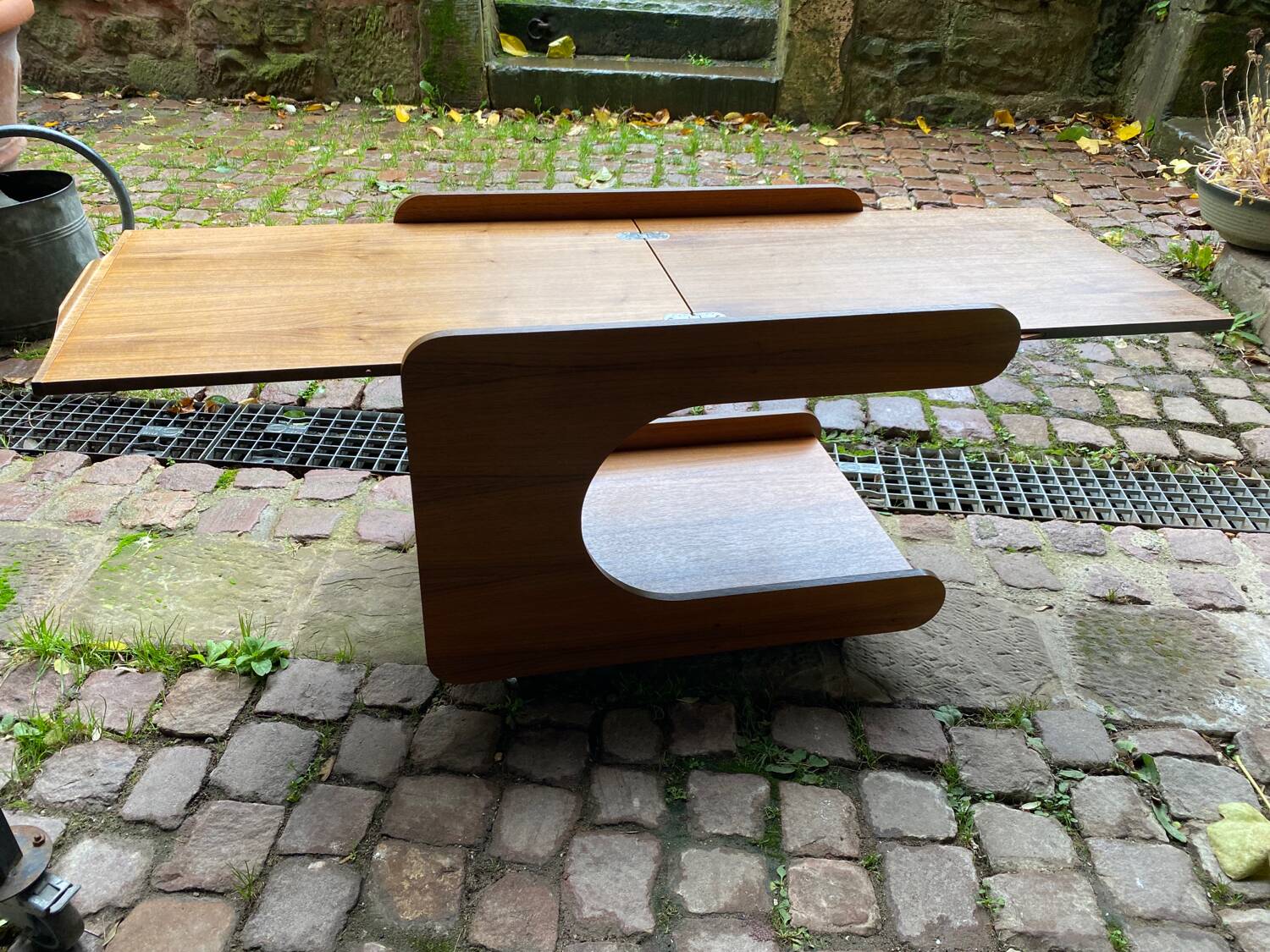 Rolling teak coffee table with foldable top circa 1960