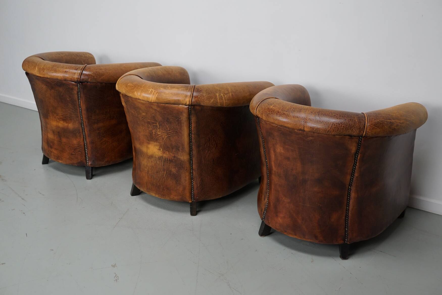 Fauteuils club vintage hollandais en cuir cognac, lot de trois