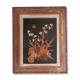 Wood frame dried flowers under glass, black background, vintage