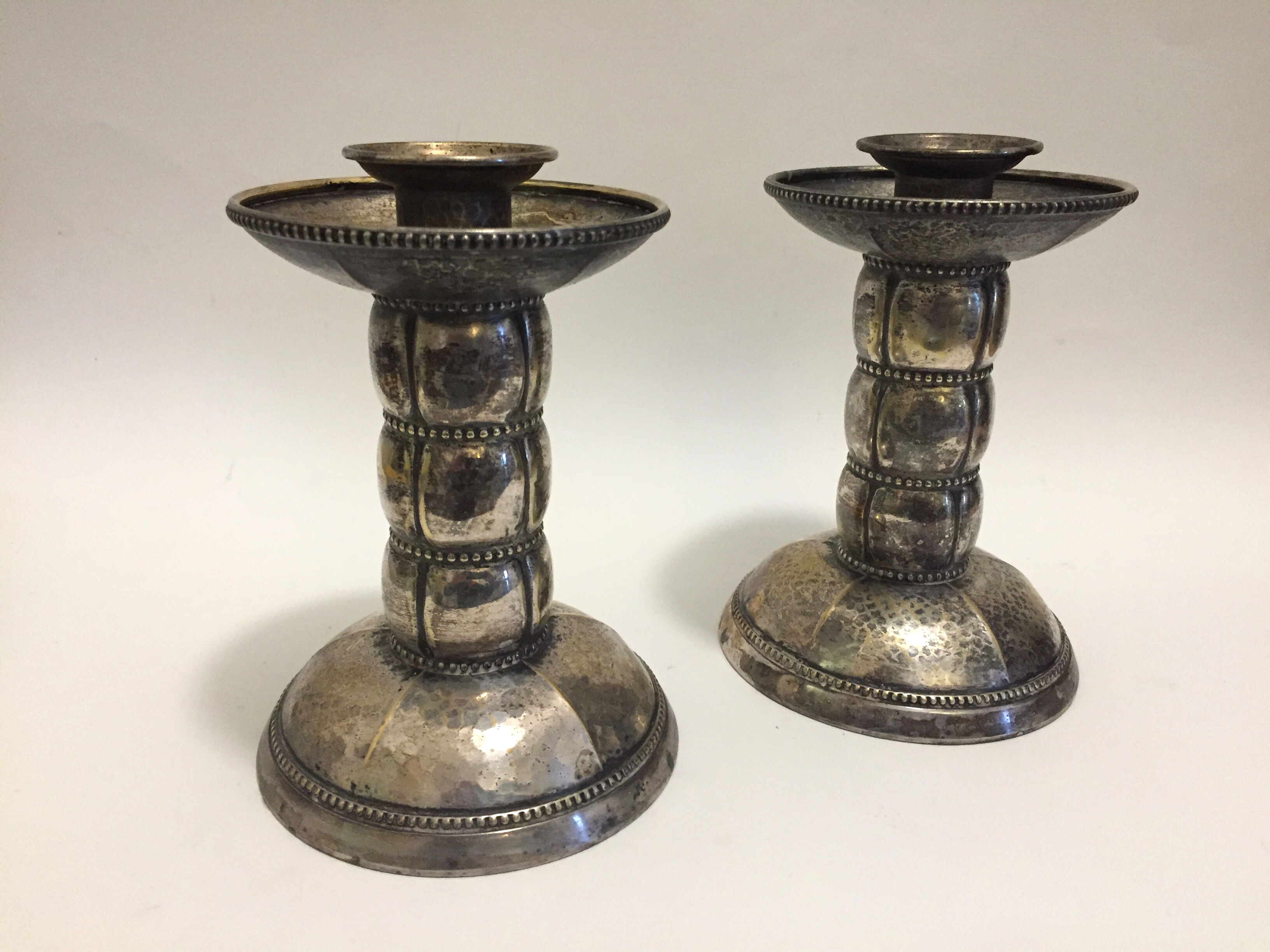 Pair of silver metal candle holders