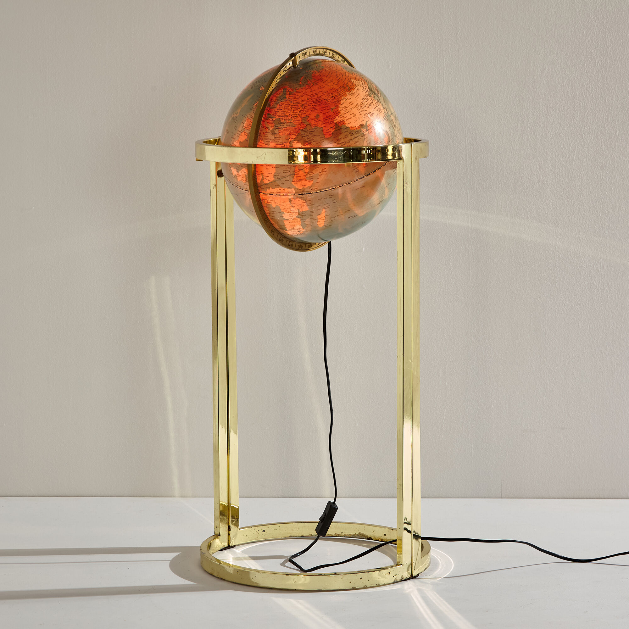 Illuminated globe on brass frame, 1980s