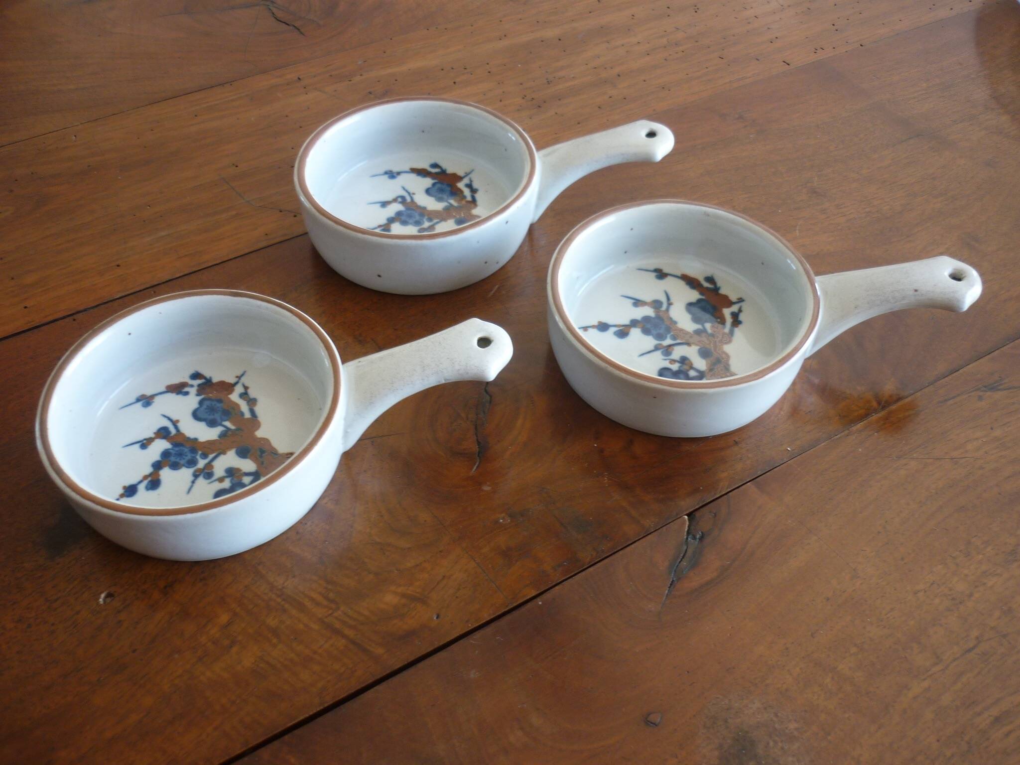 3 ceramic casserole dishes with blue and brown branch pattern