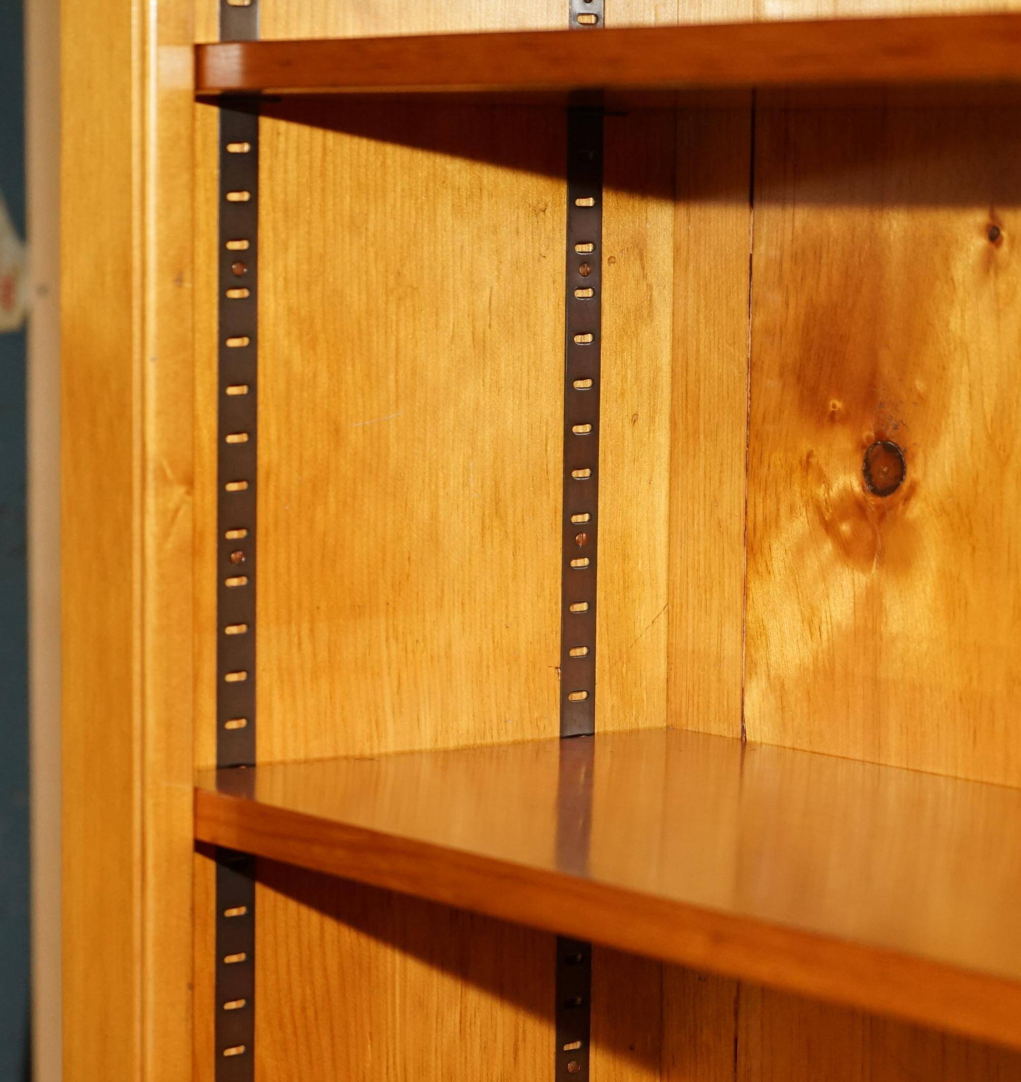 Pair of vintage cherry wood bookcases with lockable doors.