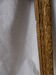 Cadre en bois doré sculpté