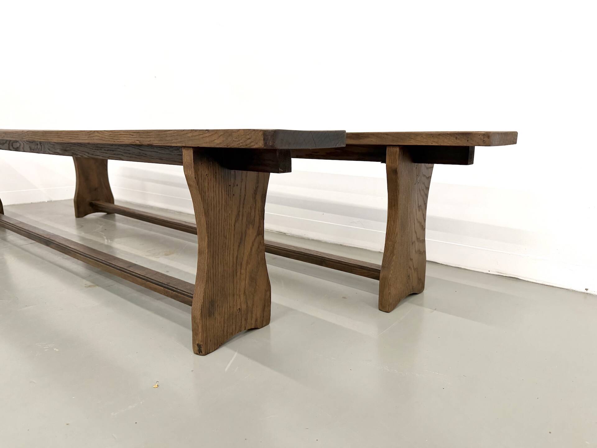 Pair of solid oak benches, winged legs, France, 1970s
