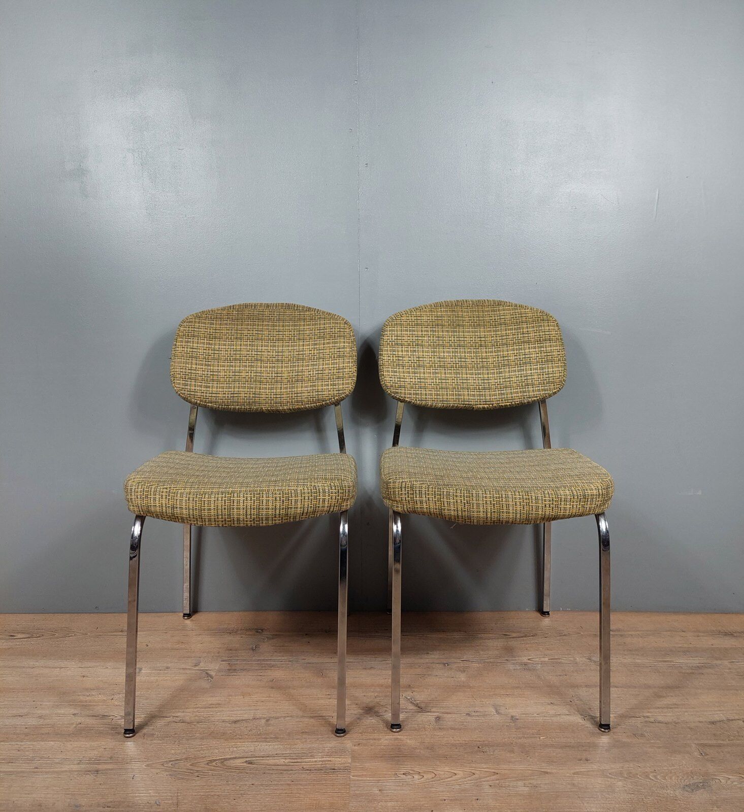 Pair of vintage chairs in fabrics and metal