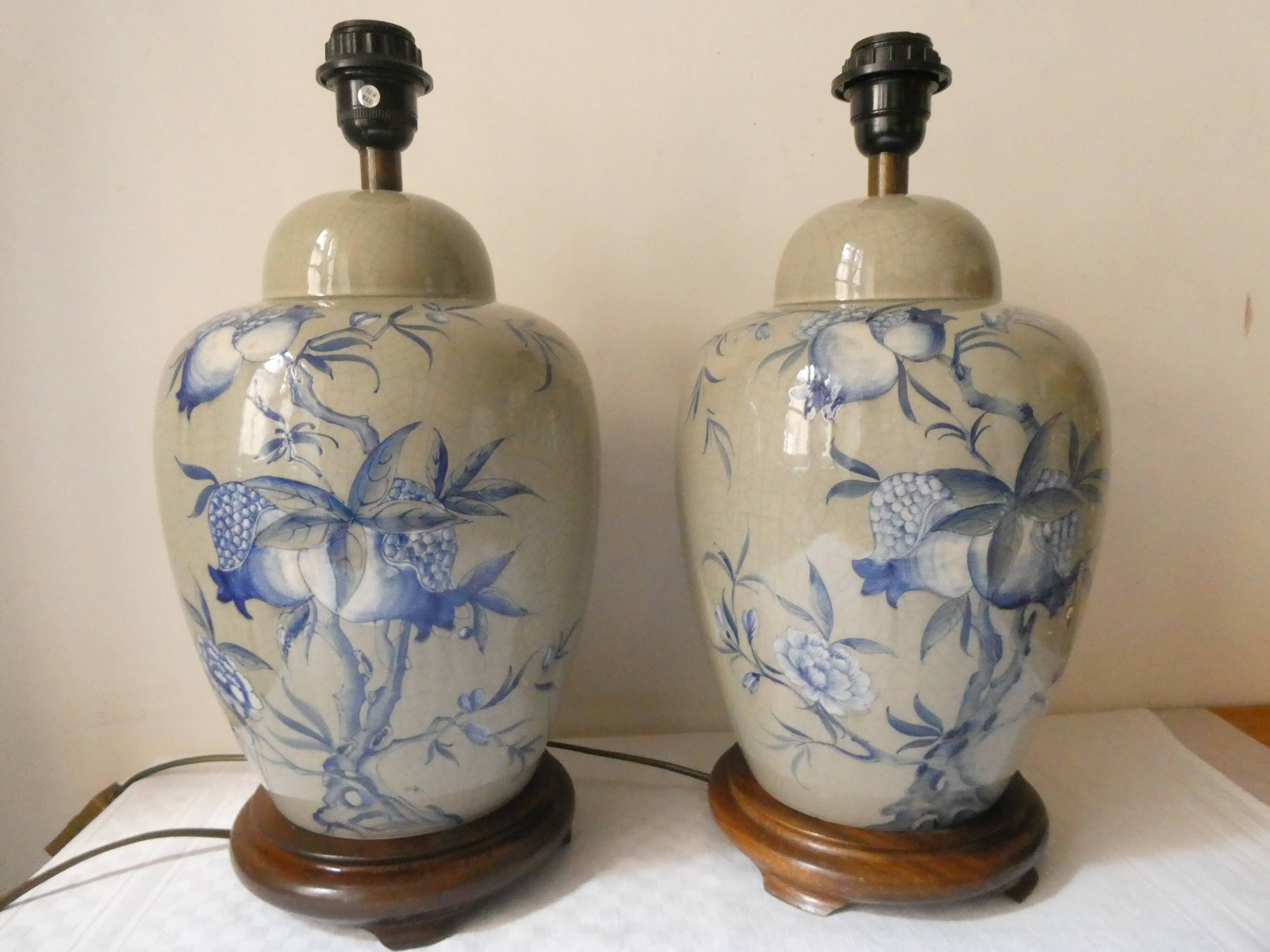 Pair of celadon crackle ceramic lamp bases decorated with flowers.