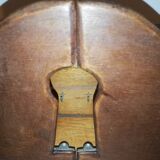 Old wooden key box cut out in the shape of a lock