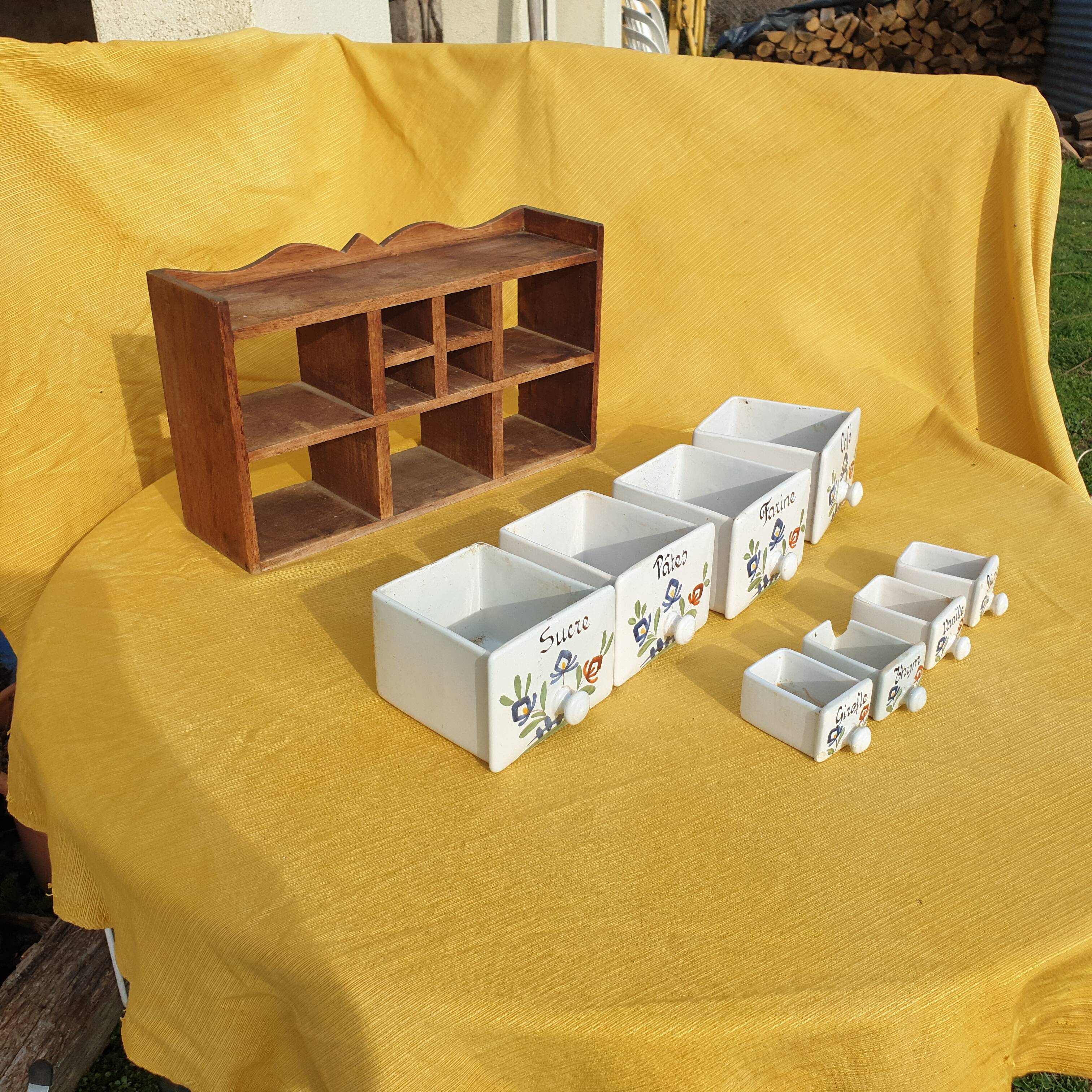 Vintage wooden spice rack with ceramic drawers