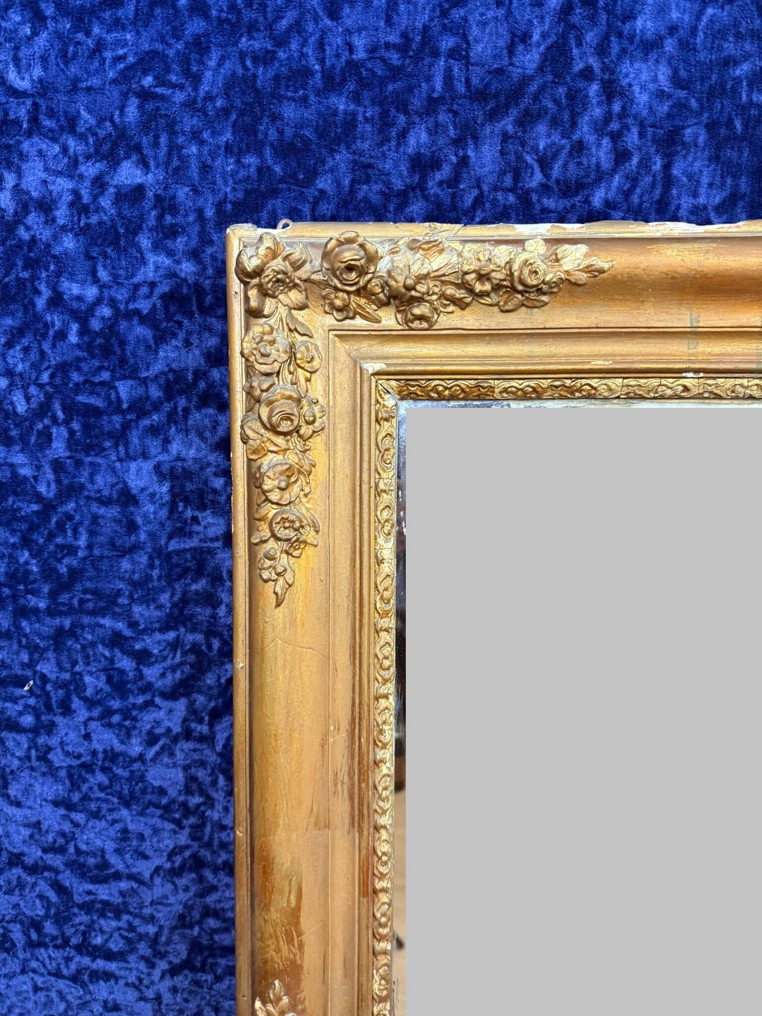 Empire period mirror in wood and gilded stucco circa 1810-1820