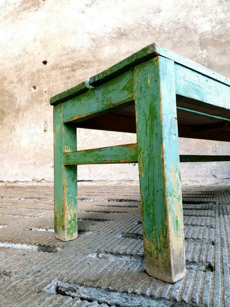 Old wooden bench sidetable green