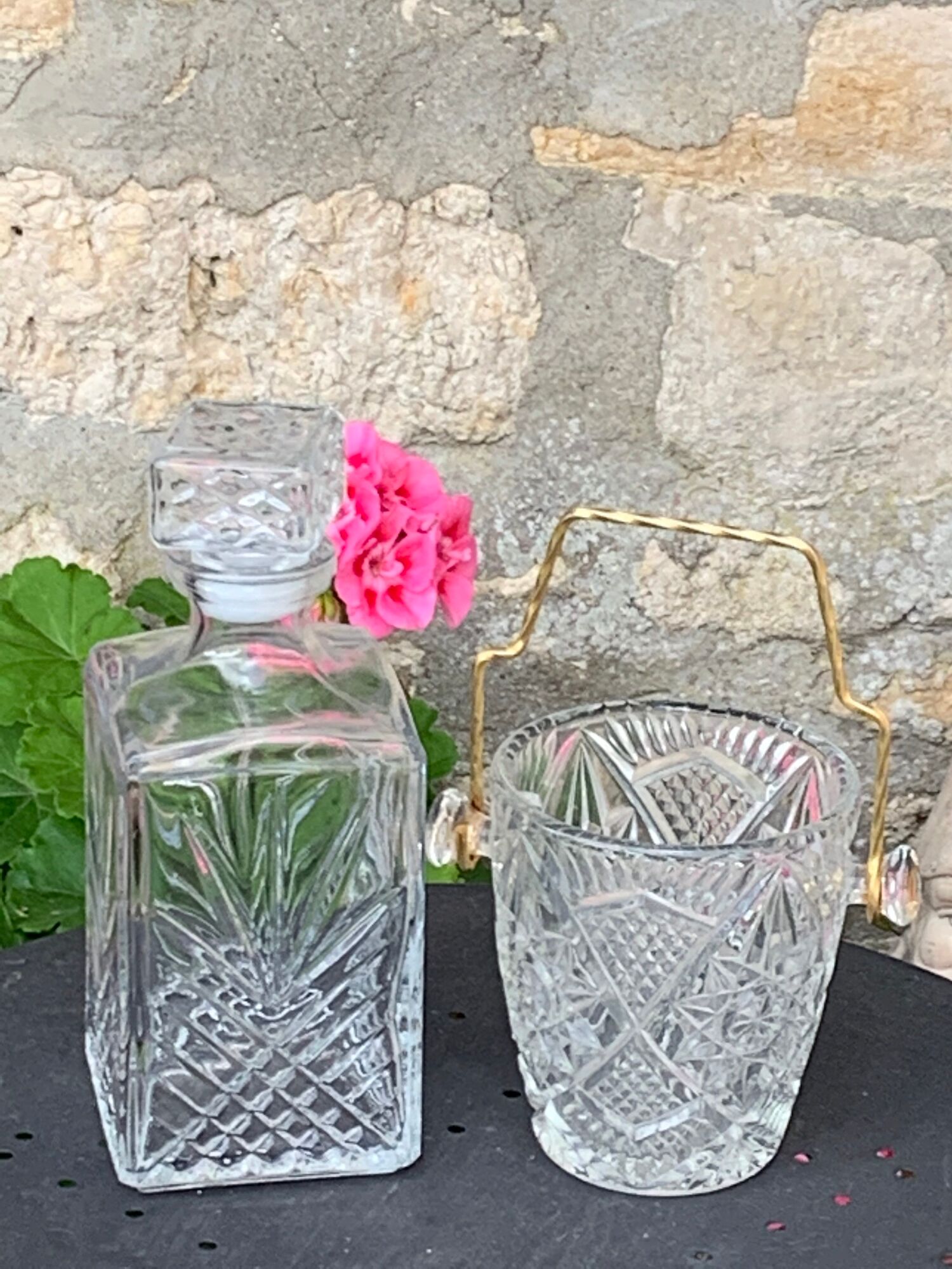 Ice bucket and whiskey decanter made of vintage chiseled transparent glass