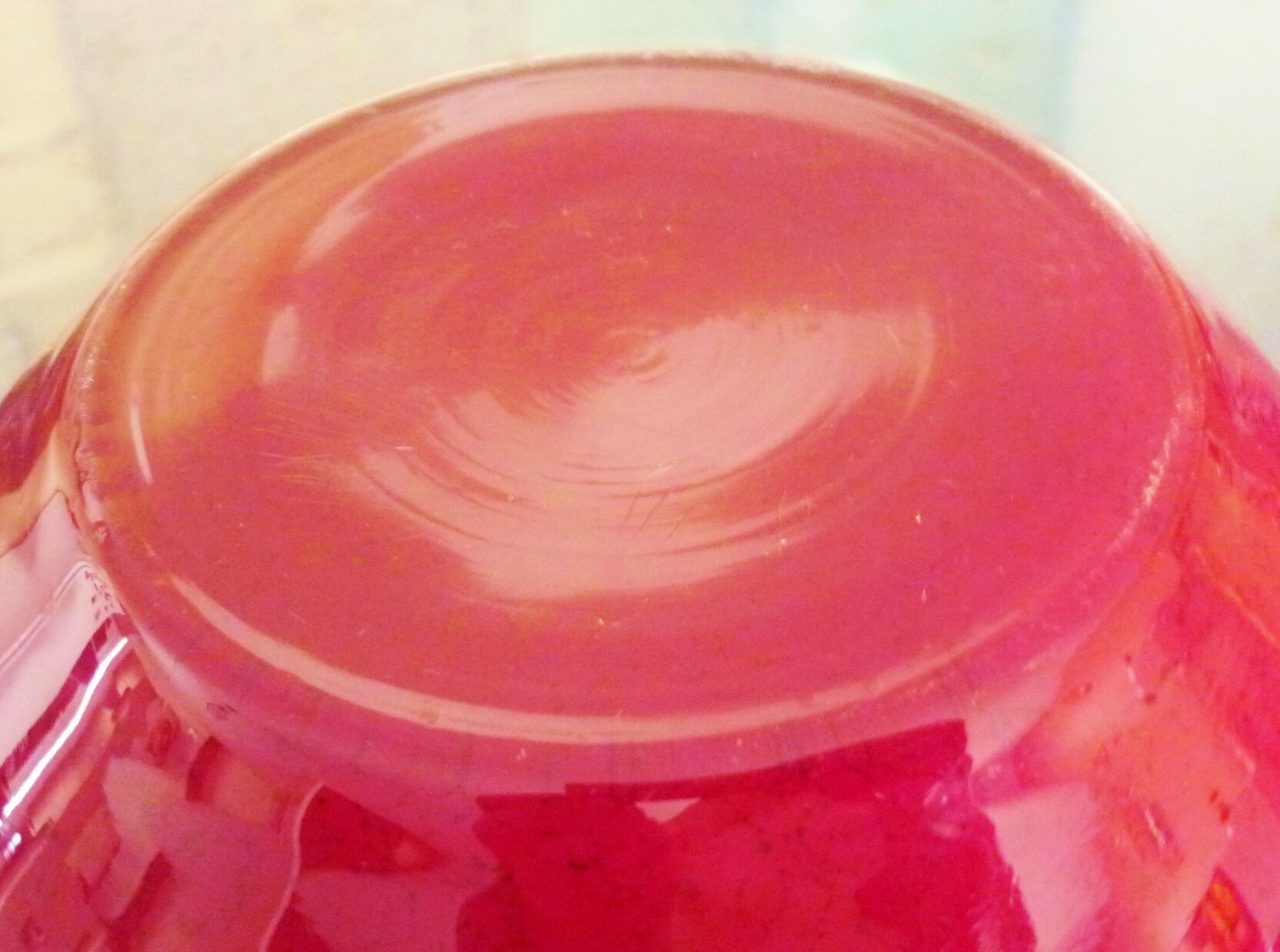 Pot-bellied, art deco vase in speckled ruby red multi-layered glass, white interior