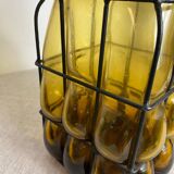 Glass carafe encased in wrought iron