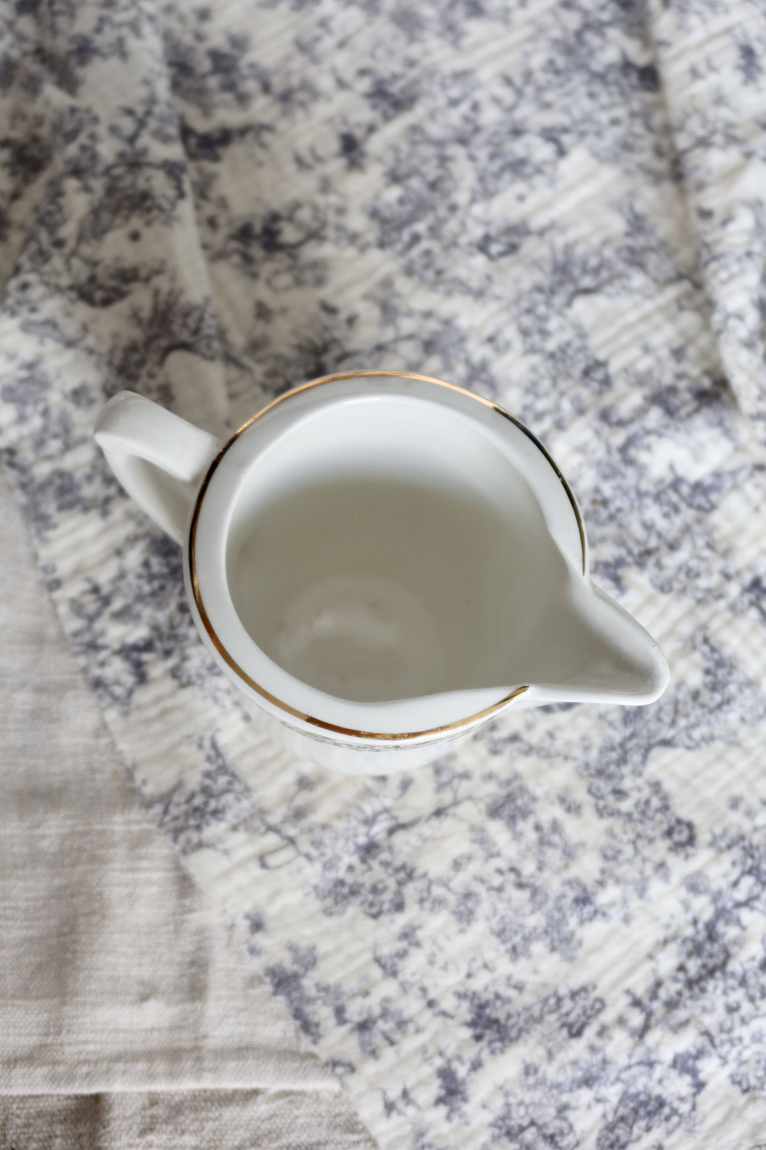 Vintage earthenware milk jug from Moulin des Loups – Gold floral motif