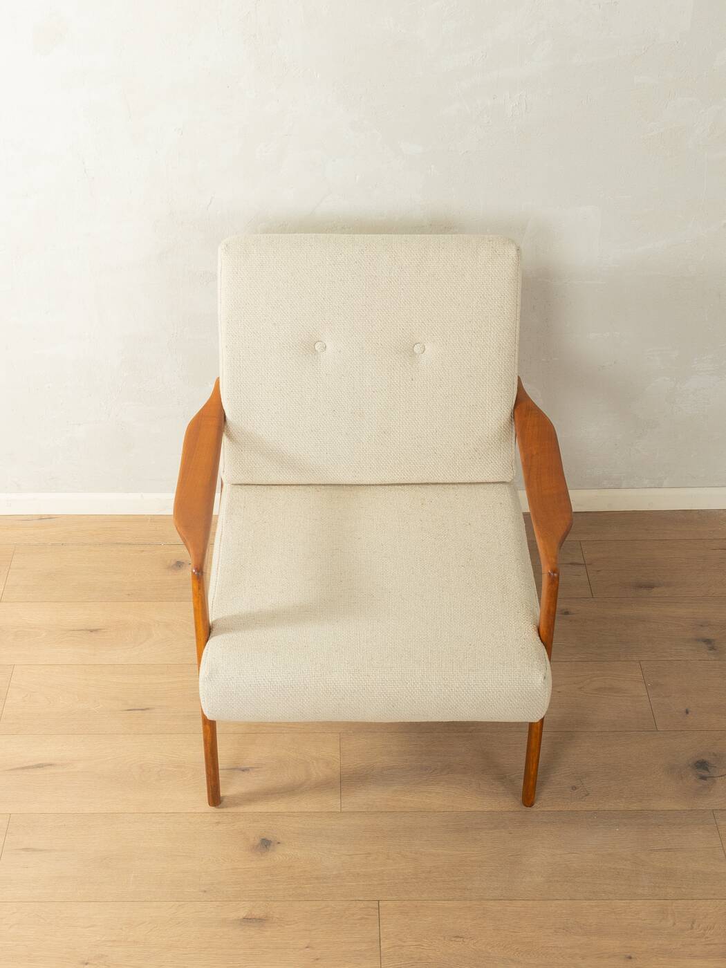 Elegant mid-century armchair from the 1960s with cream-white upholstery