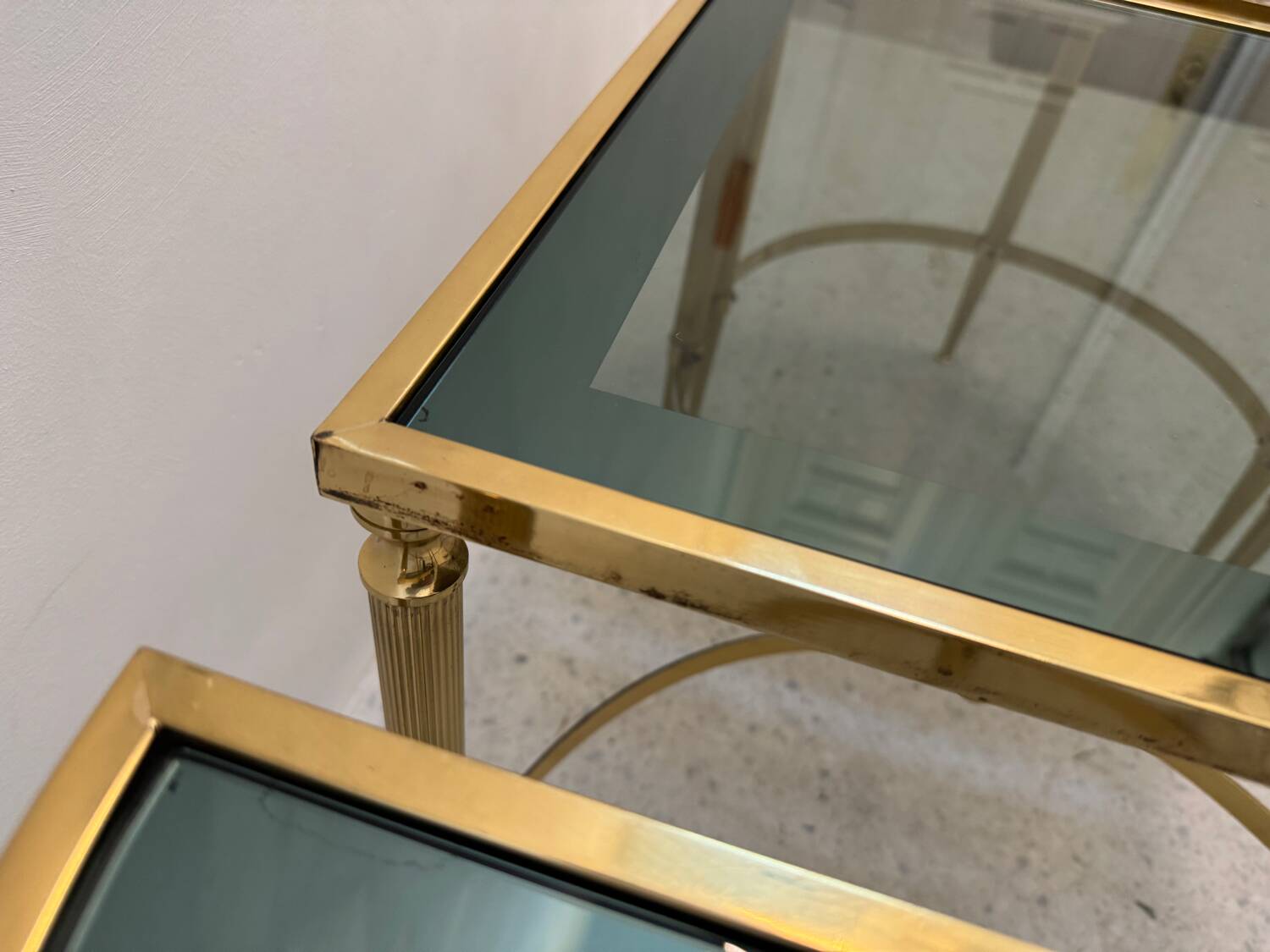 Neo classic coffee table in brass and smoked glass