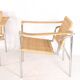 Pair of wicker and chrome armchairs