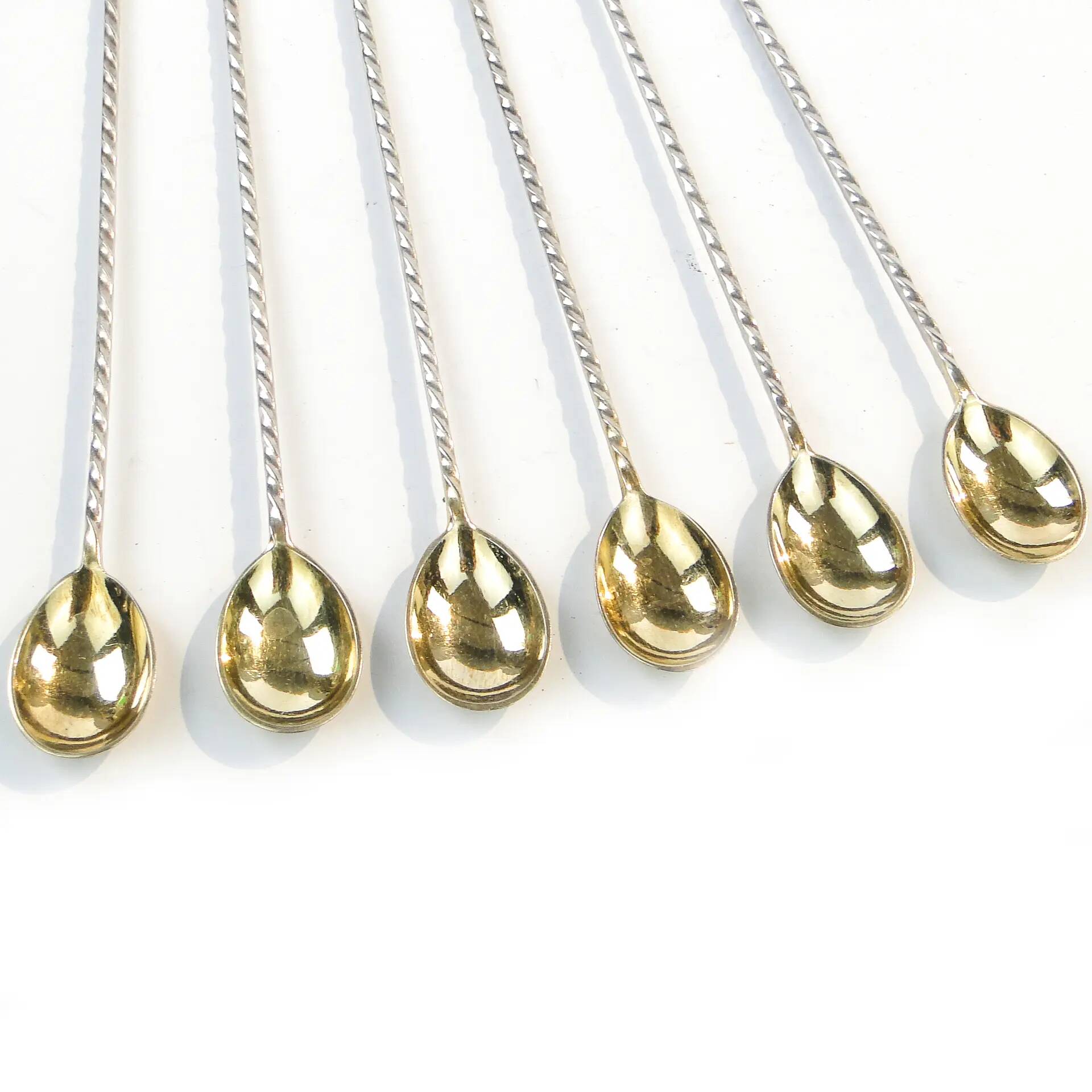 Set of neoclassical cocktail spoons, silver-plated brass, G.A.B., Sweden, 1930s