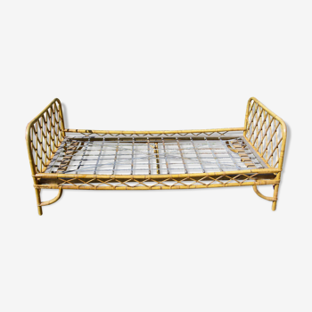 Vintage rattan bed with its box spring