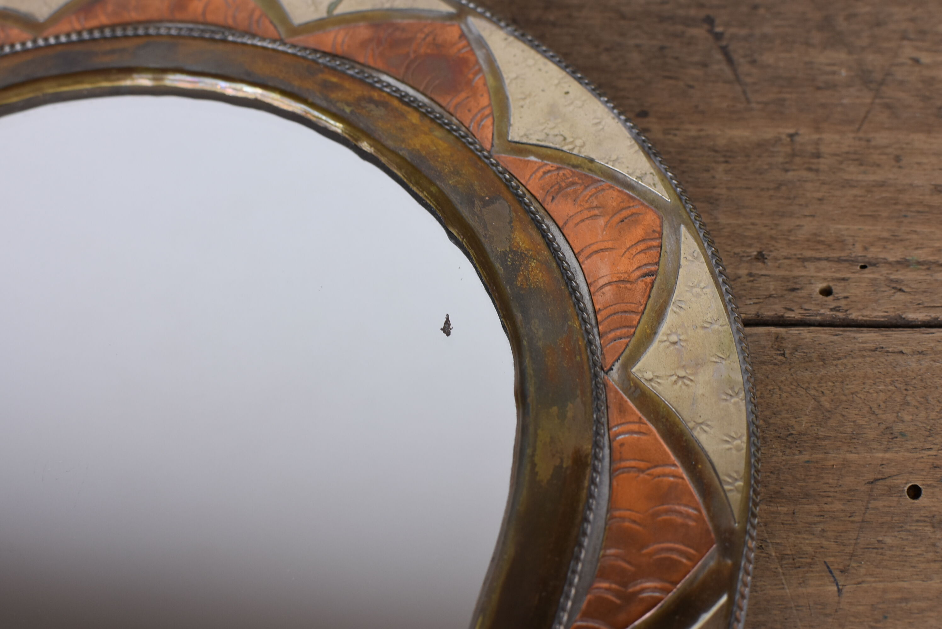 Decorated brass mirror.
