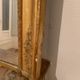 Nineteenth century mirror in wood and stucco gilded with rich gold leaf ornamentation, 101x127 cm