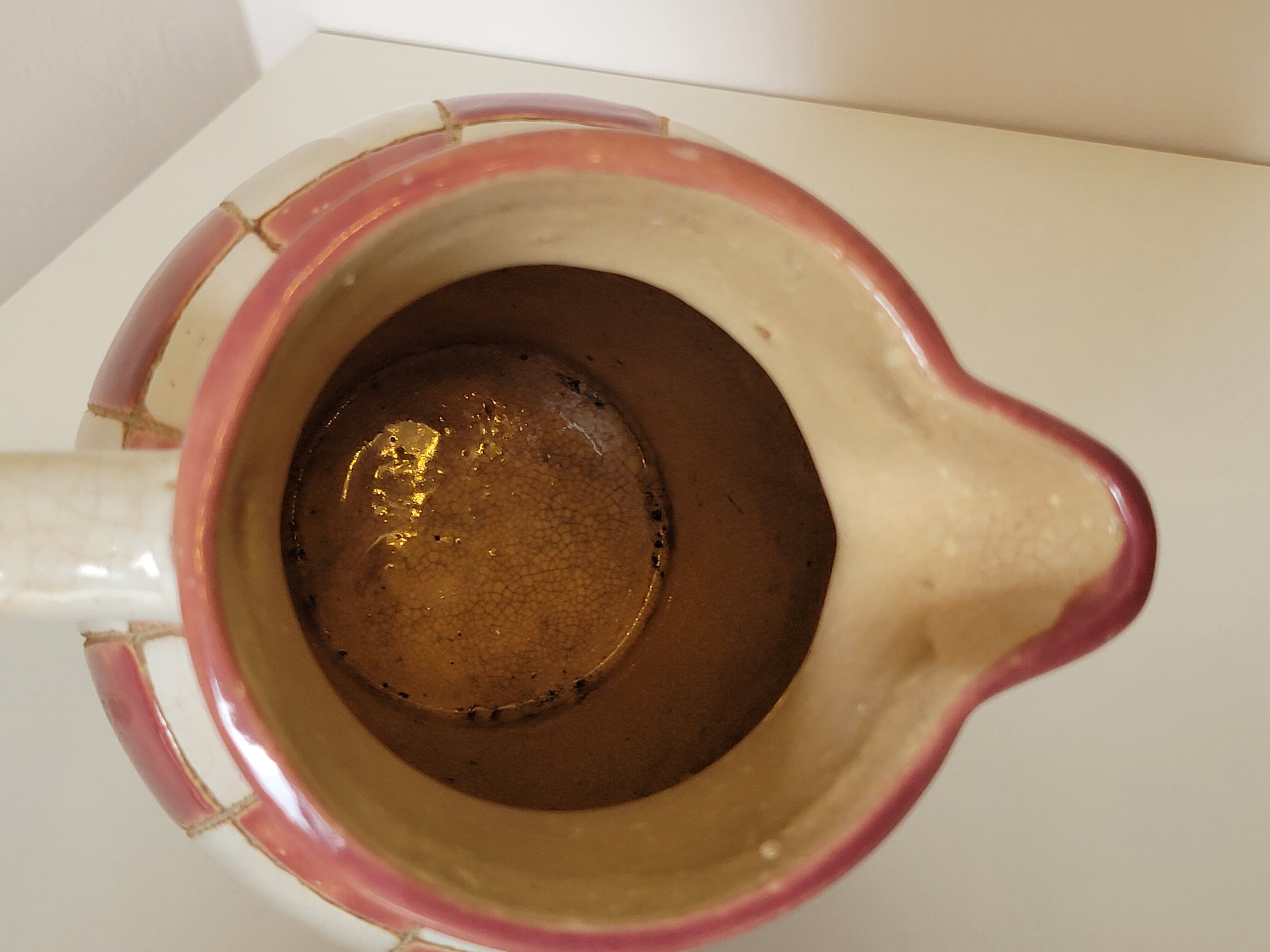 Old ceramic pitcher pattern checkerboard tiles