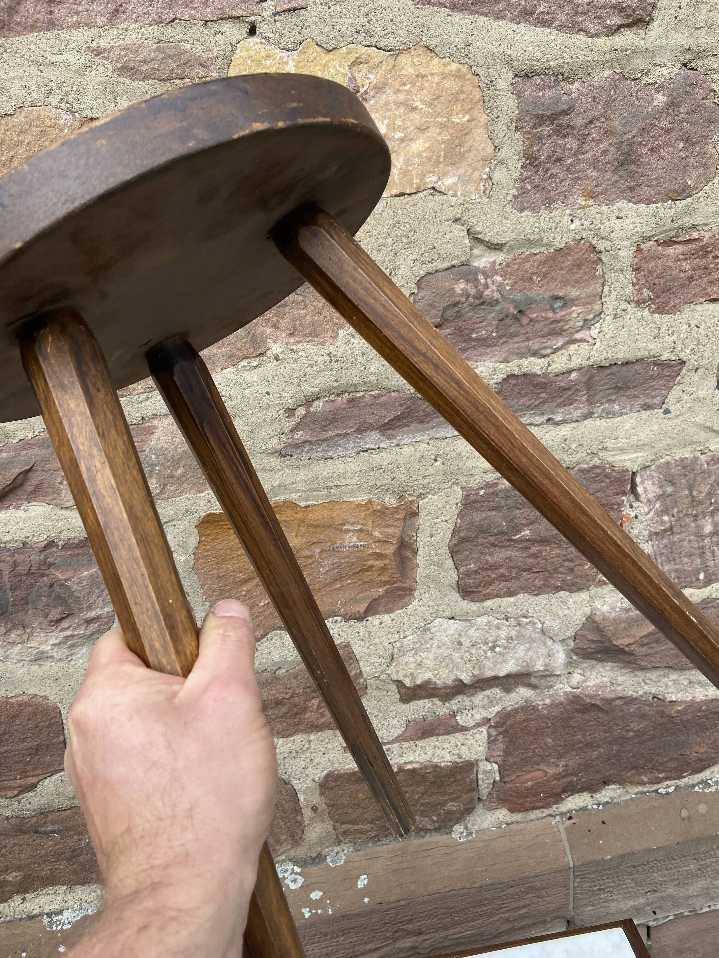 Brutalist rustic tripod farm stool made of vintage wood