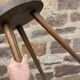 Brutalist rustic tripod farm stool made of vintage wood