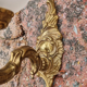 Pair of bronze wall lamps and frosted glass globe, early twentieth century.