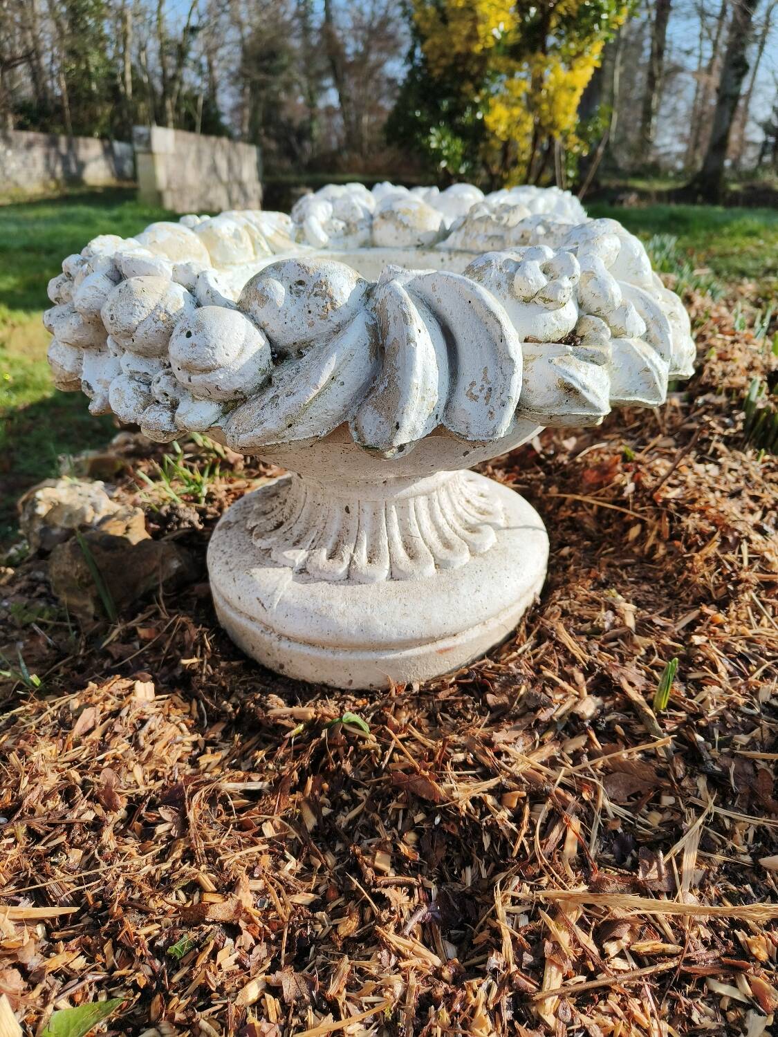 Pair of round stone fruit bowls on foot