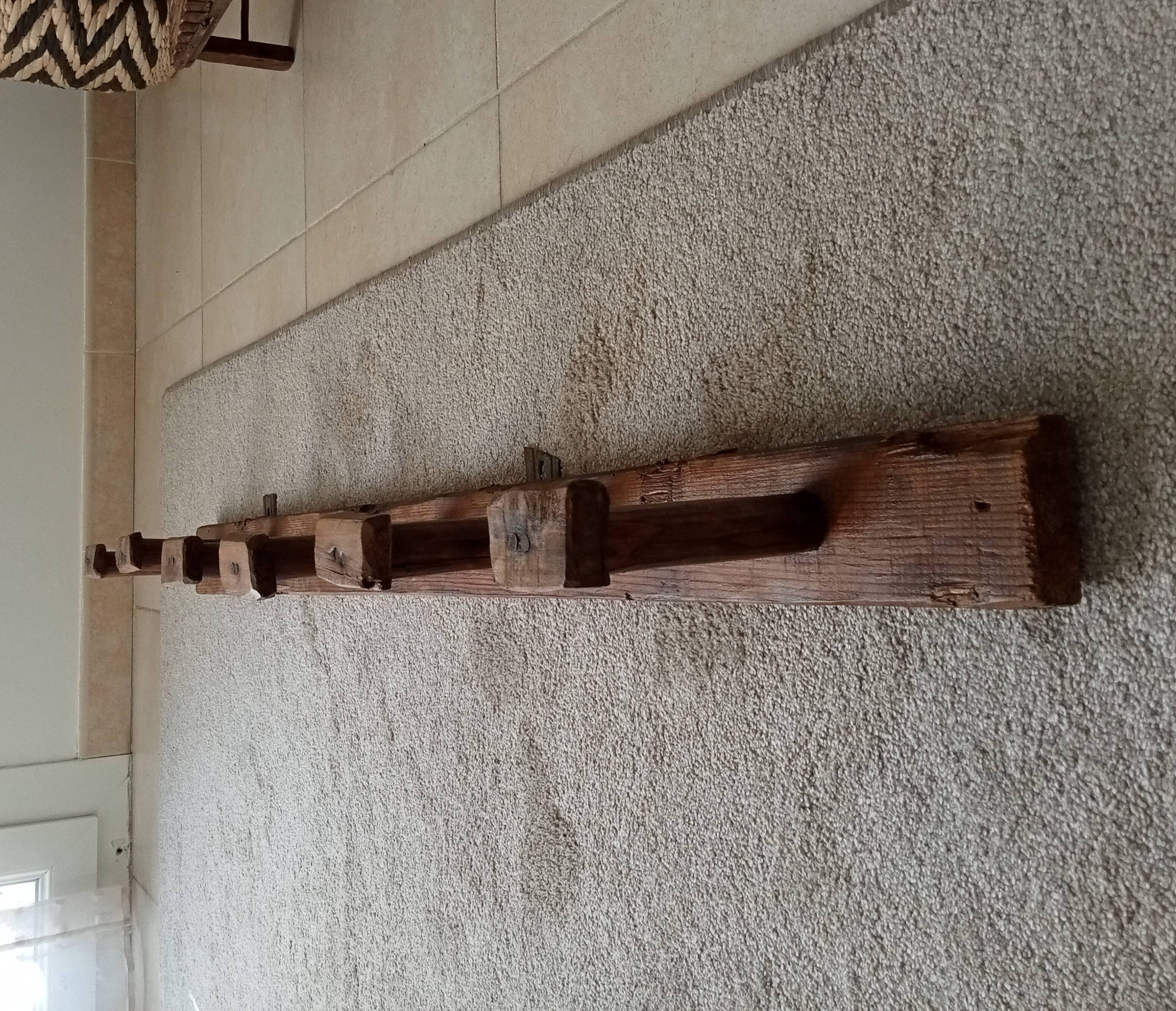 Old wall-mounted coat rack from a stable, folk art.