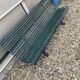Garden bench in metal foot slats