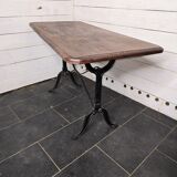 Table de bistrot pieds en fonte dessus en bois massif