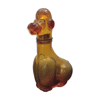 Old bottle in amber glass "poodle"