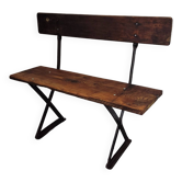 Old garden bench with iron legs and wooden seats