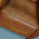 Vintage french moustache back cognac-colored leather club chair