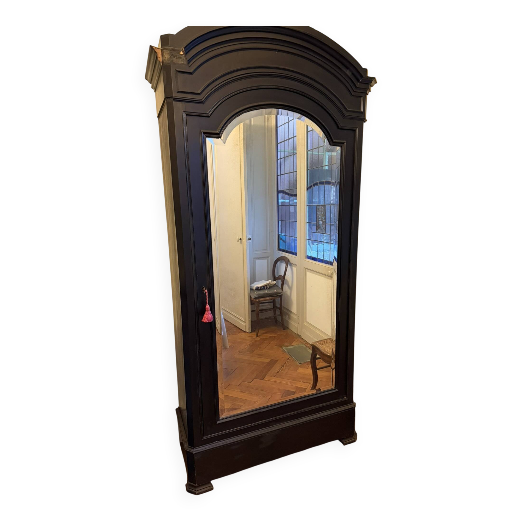 Black wardrobe with a mirrored door in ebony finish.