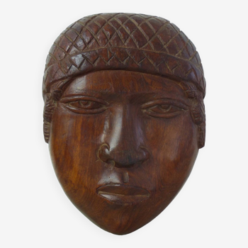 Sculpture visage en bois brut