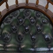 Dark green cowhide leather and wood chesterfield office chair on wheels