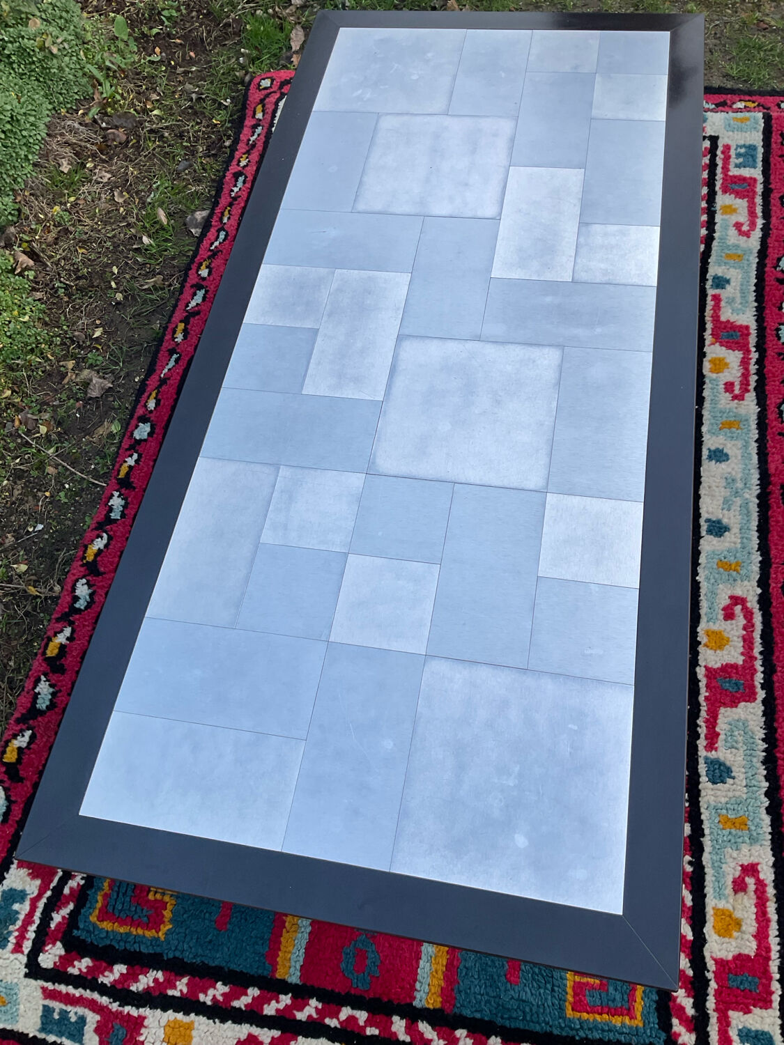 Vintage coffee table in stainless steel and black lacquered wood.