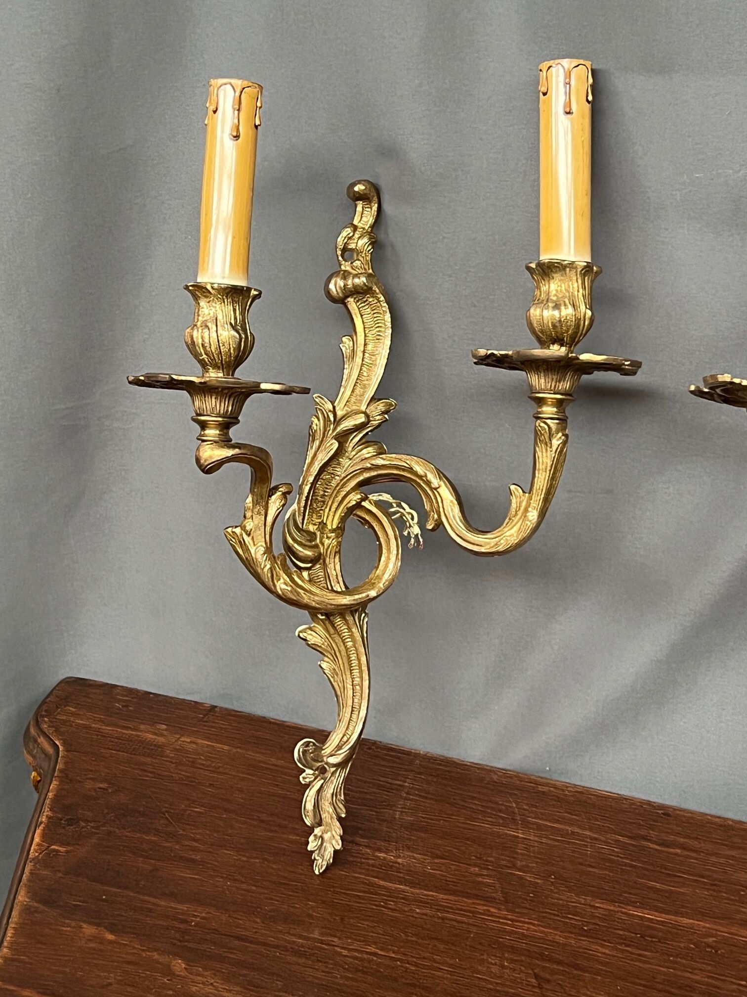 Set of three bronze wall sconces.